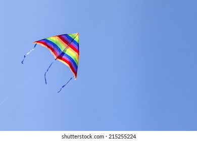 A Kite Isolated On A Clear And Blue Sky