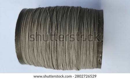 kite string spools neatly arranged and ready for use, representing an essential accessory for traditional kite flying, outdoor recreation, and family leisure activities.