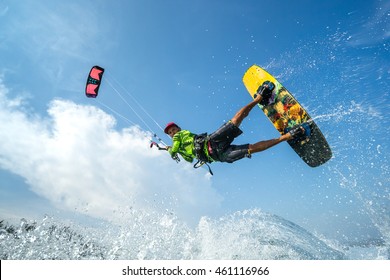 A kite surfer rides the waves