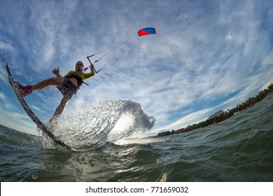 A Kite Surfer Rides The Waves