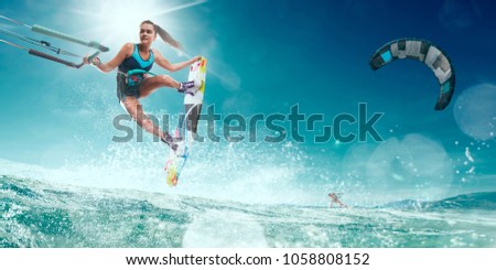 A kite surfer rides the waves