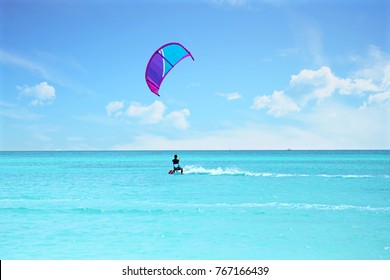 Kite Surfing At Aruba Island In The Caribbean Sea