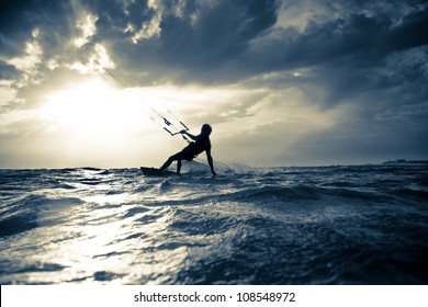 Kite Surfing At Sunset.