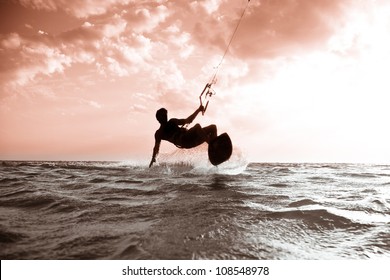 Kite Surfing At Sunset.