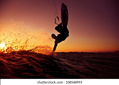 Kite Surfing At Sunset.