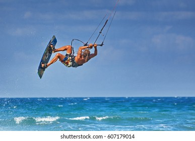 kiteboarder athlete performing kiteboarding kitesurfing tricks unhooked 