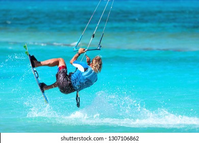 Kiteboarder kitesurfer athlete performing kitesurfing kiteboarding tricks unhoocked