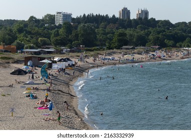 Kiten, Burgas Province, Bulgaria. 01.08.2021. Holidaymakers, on the Black Sea coast. People sunbathe on the beach and swim in the sea.