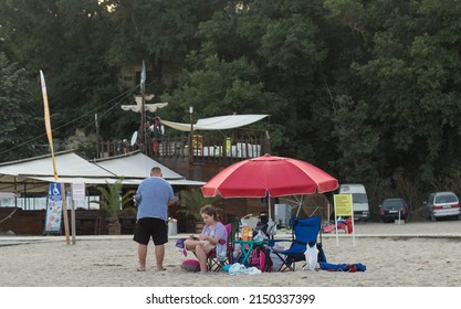 Kiten, Burgas Province, Bulgaria. 03.08.2021. Holidaymakers, on the Black Sea coast. People sunbathe on the beach and swim in the sea.
