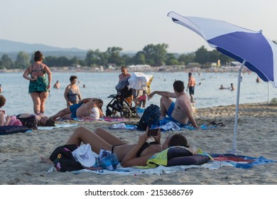 Kiten, Burgas Province, Bulgaria. 03.08.2021. Holidaymakers, on the Black Sea coast. People sunbathe on the beach and swim in the sea.