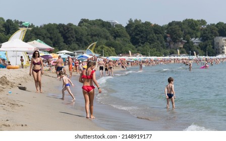 Kiten, Burgas Province, Bulgaria. 30.07.2021. Holidaymakers, on the Black Sea coast. People sunbathe on the beach and swim in the sea.