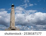  Kites flying behind the Portsmouth Naval Memorial Portsmouth International Kite Festival July 2024