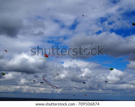 Similar – a colorful garland blows in the wind on the north sea