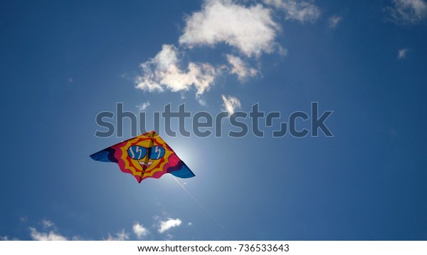 Kites in the sky. Colorful kites flying in
blue sky. Under the blue sky flying
kites
