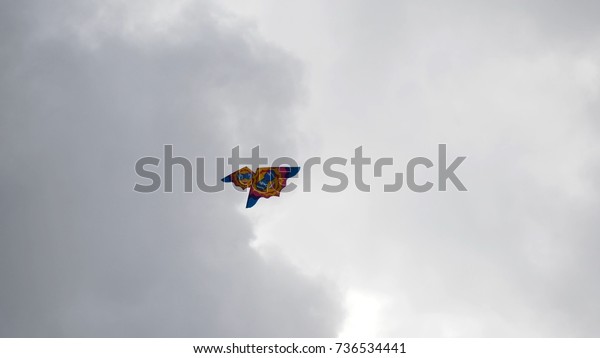 Kites in the sky. Colorful kites flying in
blue sky. Under the blue sky flying
kites
