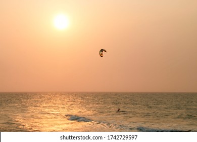 Kitesurfer on a wave at sunset in Cartagena, Colombia