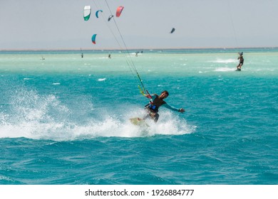 Kitesurfing on the waves of the Red sea, Egipt. Kitesurfing, Kiteboarding action photos Kitesurfer In action