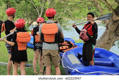 KIULU, SABAH MALAYSIA- MARCH 14, 2017: Whitewater Rafting Guide Delivers A River Safety Briefing And The Basics Of Guiding A Raft Before Starting The Whitewater Rafting Activity At Kiulu River