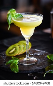 kiwi cooler cocktail with fresh basil & ice - Shutterstock ID 1480349408