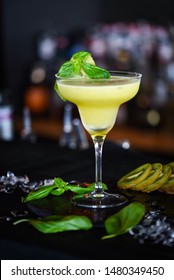kiwi cooler cocktail with fresh basil & ice - Shutterstock ID 1480349450