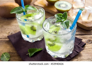 Kiwi Drink (cocktail) With Mint And Ice In Glasses Close Up