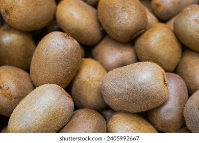 Kiwi fruit close up in the store, fresh and juicy green kiwifruit as background - Powered by Shutterstock