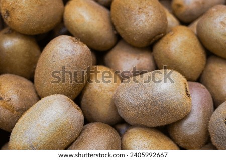Kiwi fruit close up in the store, fresh and juicy green kiwifruit as background