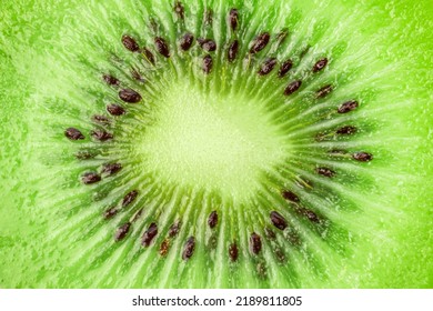 Kiwi Fruit. Cross Cut Of Kiwi Juicy Flesh With Seeds Closeup.