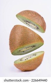 Kiwi Fruit Cut Into Three Pieces That Weigh In The Air