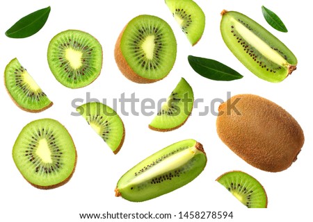 kiwi fruit with slices and green leaves isolated on a white background. top view