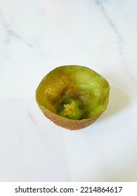 Kiwi Fruit That Has Been Scraped Off. Only The Skin Remains