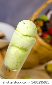 Kiwi Ice Cream Scoops In Tall Dessert Glass. 