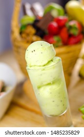 Kiwi Ice Cream Scoops In Tall Dessert Glass. 