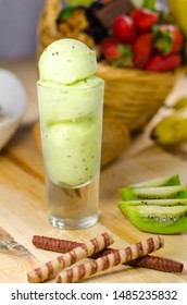 Kiwi Ice Cream Scoops In Tall Dessert Glass. 