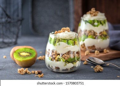 Kiwi Parfait Dessert In Glass On Dark Background