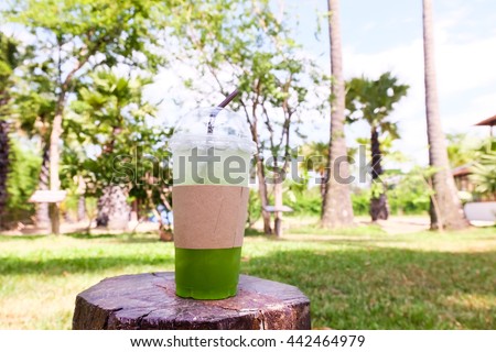Kiwi soda in a glass ,nature background.