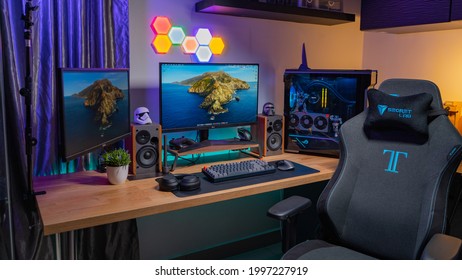 KL, MALAYSIA - June 26th, 2021 :                     A Work From Home Office Setup. HTPC, Hackintosh PC  Gaming PC Rig With Liquid Cooling Setup And Full RGB Light Inside 