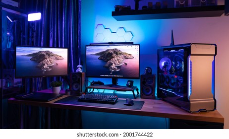 KL, MALAYSIA - June 26th, 2021 :  A Work From Home Office Setup. HTPC, Hackintosh PC  Gaming PC rig with liquid cooling setup and full RGB light inside 