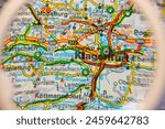 Klagenfurt,Austria,map seen through a magnifying glass,selective focus