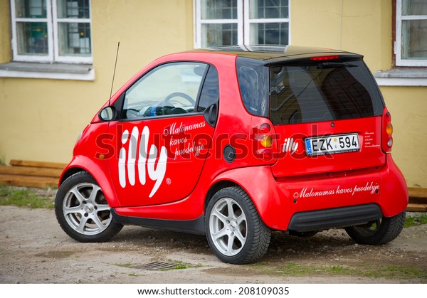 KLAIPEDA -\
JUNE 16: Smart Car parked up on June 16, 2014 in Klaipeda,\
Lithuania. Smart Automobile is a division of Daimler AG that\
manufactures and markets the Smart Fortwo.\
