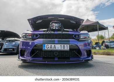 Klaipeda, Lithuania - September 04 2021: Purple Color Dodge Charger SRT Hellcat Stands On The Parking Lot With The Hood Open After The Drag Race.