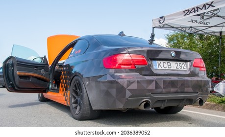 Klaipeda, Lithuania - September 04 2021: The BMW Car Stands On The Parking Lot With The Hood Open After The Drag Race.