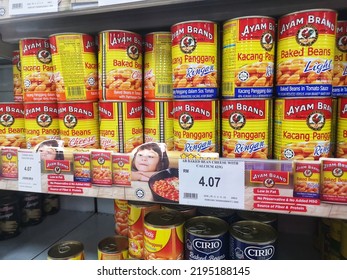 Klang, Malaysia - 13 August 2022 : AYAM BRAND Baked Bean Cans Display For Sell On The Supermarket Shelf With Selective Focus.