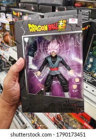 Klang, Malaysia - 30 July 2020 : Hand Hold A Boxed Of Dragon Ball Super Saiyan Rose Goku Black Toy Character For Sale In Supermarket Store With Selective Focus.  