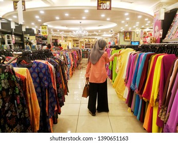 Klang, Malaysia - 4th May 2019: A Woman Choose The Dress For Hari Raya Preparation