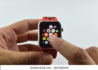 Klang, Malaysia: 5th September 2020-Hand holding and touching an apple watch. Apple Watch 4 Nike Edition which just Launched this Month on November 11,2018. Isolated on a white background.