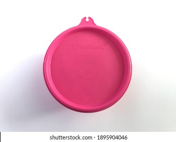 KLANG, MALAYSIA - January 17, 2021 : Top View Of Tupperware Brand Pink Lid Container Isolated On White Background