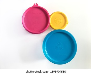 KLANG, MALAYSIA - January 17, 2021 : Top View Of Tupperware Brand Lid Containers Isolated On White Background