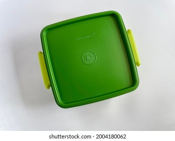 KLANG, MALAYSIA - July 8, 2021 : Top View Of Green Tupperware Brand Container Isolated On White Background