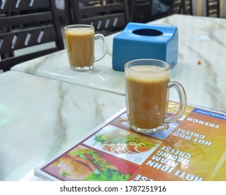 Klang, Selangor, Malaysia: 31st July 2020- Tea With Milk In A Mug Or Popularly Known As Teh Tarik At The Mamak Restaurant, View From Side.